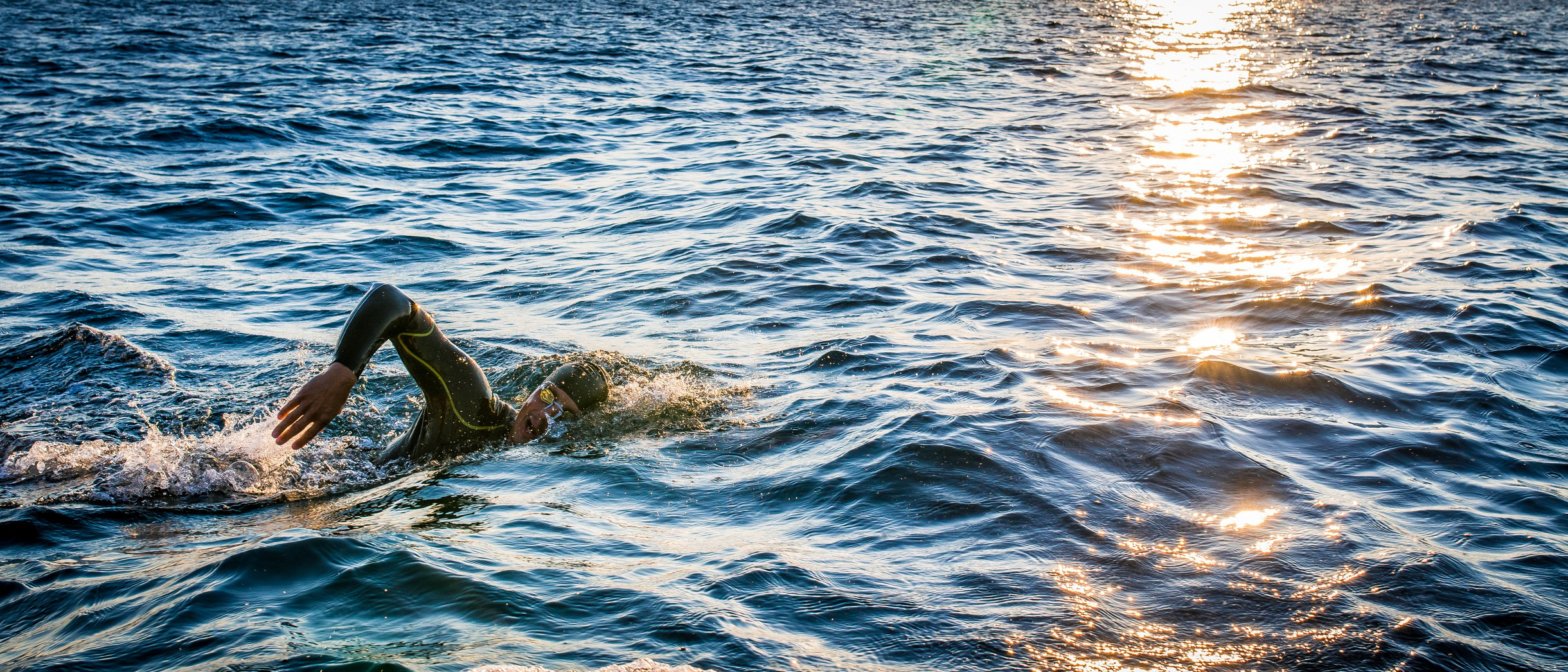 Open water swimmer swimming in sea